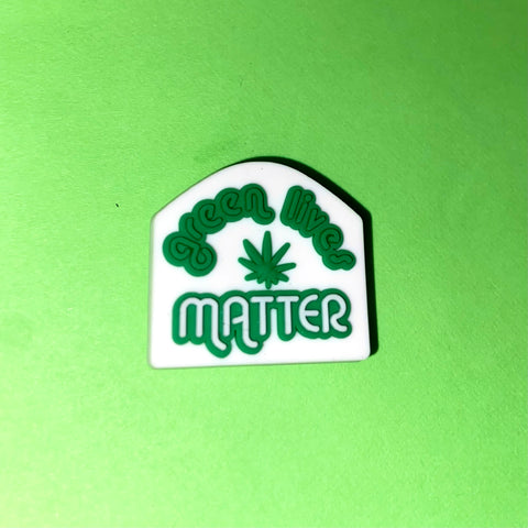 “Green Lives Matter” charm